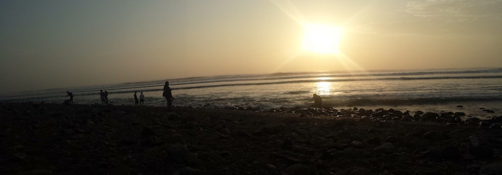 Ondergaande zon strand Huanchaco